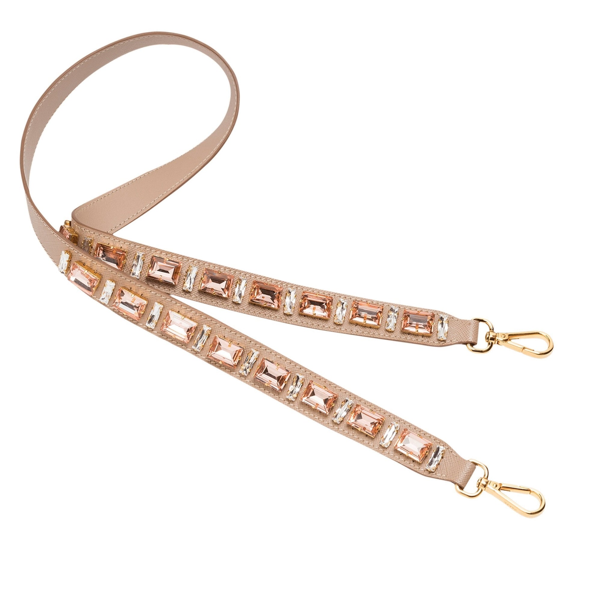 Prada Blush Pink Crystal Strap: Elegant Accessory for Any Handbag - This elegant Prada Strap adds a subtle touch of sparkle to any handbag. Featuring lobster claw clasps on both ends, it offers effortless attachment for immediate use.Model: 1TY006Cammeo Beige (Blush Pink) Saffiano LeatherJeweledLength: 41inchesIncludes authenticity cards and boxMade in Italy Shop Bags