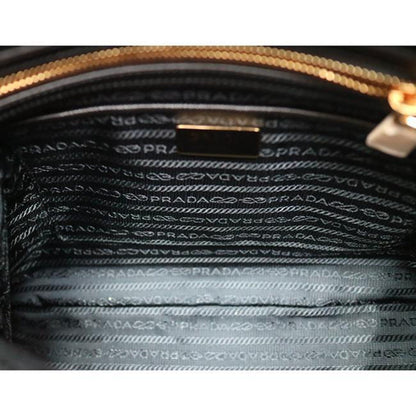 Prada Nylon & Saffiano Leather Satchel Bag - Elegant & Versatile -   Shop Bags LLC