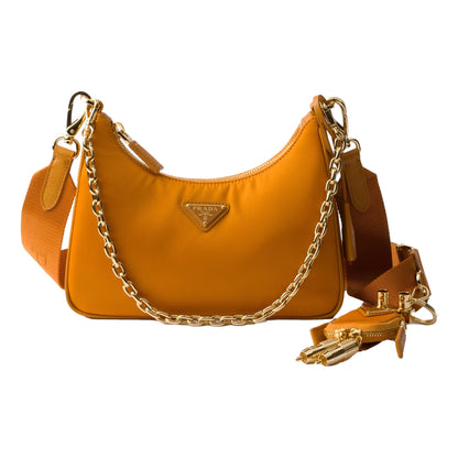 Prada Re-Edition 2005 Orange Re-Nylon and Saffiano Leather Shoulder Bag with Robot Charm Strap -   Shop Bags LLC 