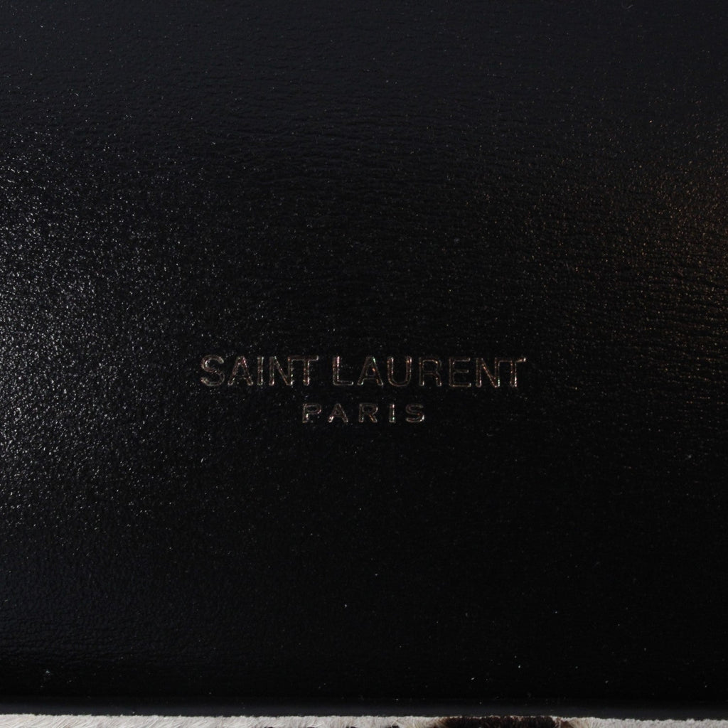 Saint Laurent Calfskin & Pony Hair Duffle Bag - Luxury & Versatile -   Shop Bags LLC