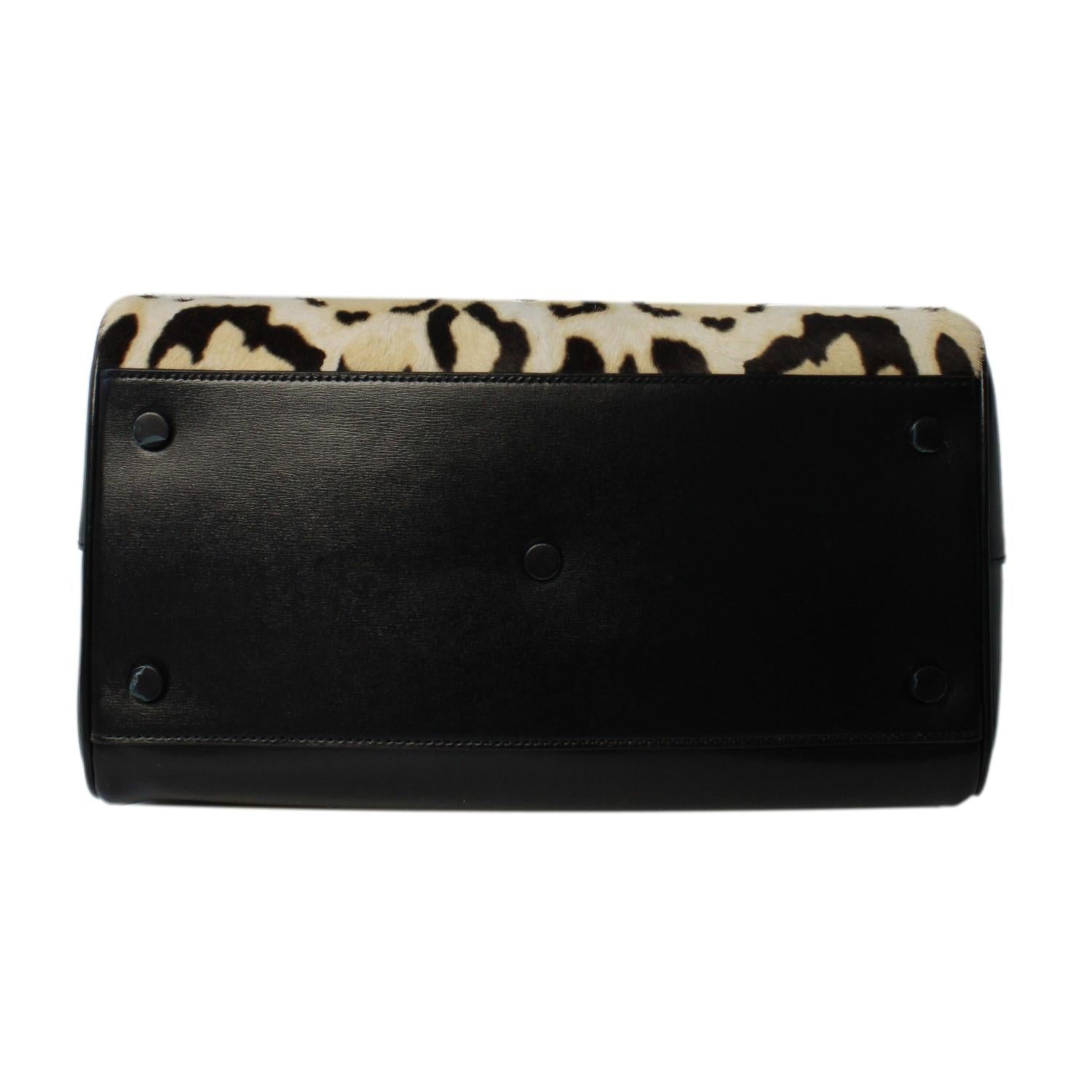 Saint Laurent Calfskin & Pony Hair Duffle Bag - Luxury & Versatile -   Shop Bags LLC