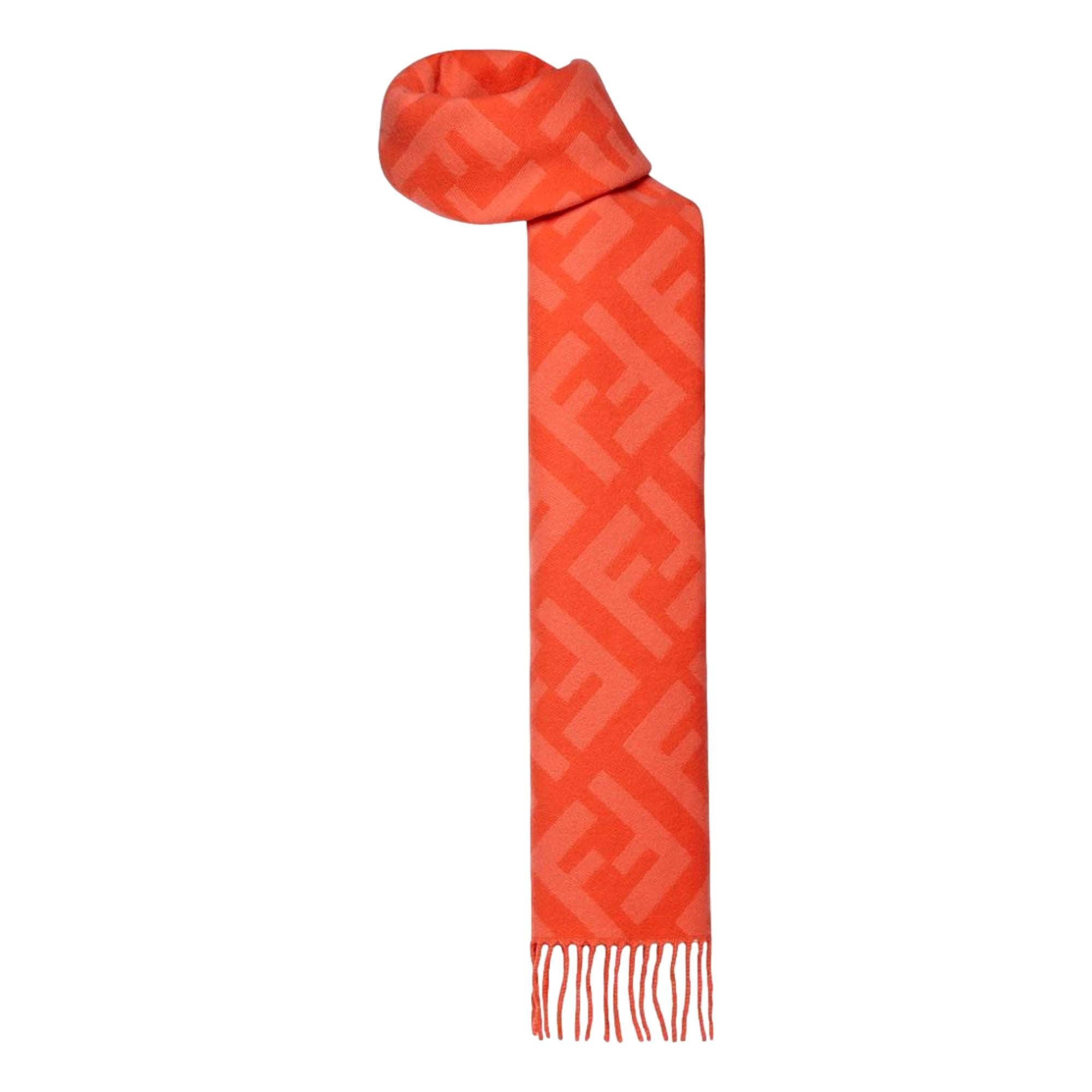 Luxurious Fendi Cashmere Scarf - Elegant FF Print & Coral Hue -  Elevate your winter style with this elegant cashmere scarf by Fendi. Crafted from luxuriously soft woven wool, it showcases the signature FF zucca pattern in a subtle tulip tone. The coral shade adds a refined touch while providing warmth and sophistication throughout the colder season. Model: FXT260Tulip ColorFF Logo printMeasurements: 140cm x 45cm Includes authenticity cards and dust bag Made in Italy Shop Bags 