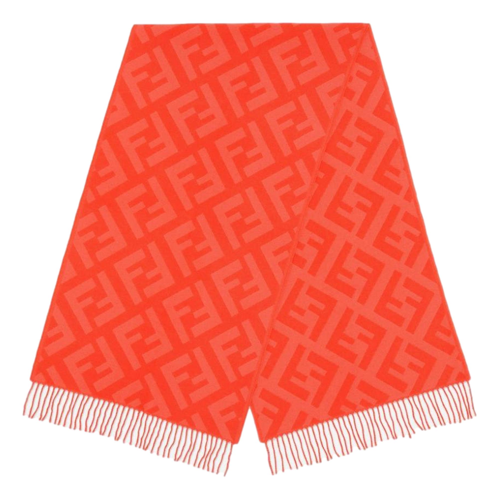 Luxurious Fendi Cashmere Scarf - Elegant FF Print & Coral Hue -  Elevate your winter style with this elegant cashmere scarf by Fendi. Crafted from luxuriously soft woven wool, it showcases the signature FF zucca pattern in a subtle tulip tone. The coral shade adds a refined touch while providing warmth and sophistication throughout the colder season. Model: FXT260Tulip ColorFF Logo printMeasurements: 140cm x 45cm Includes authenticity cards and dust bag Made in Italy Shop Bags 