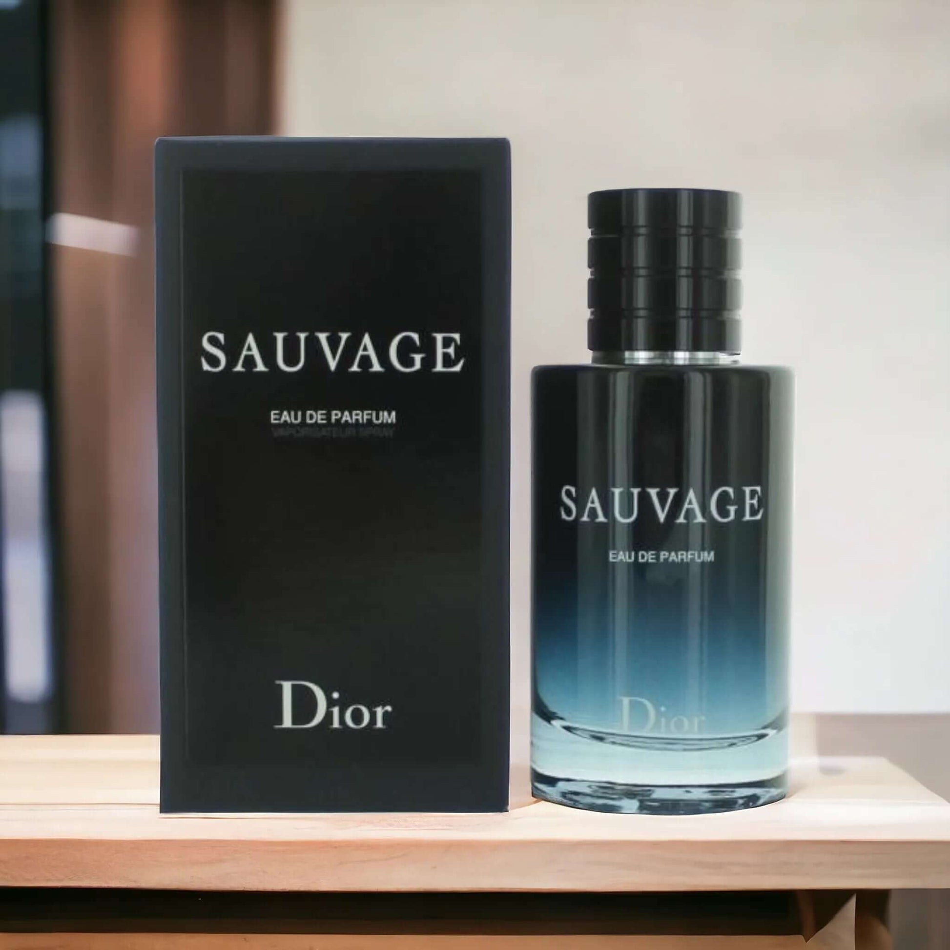 Dior Sauvage perfume bottle and packaging on a wooden surface