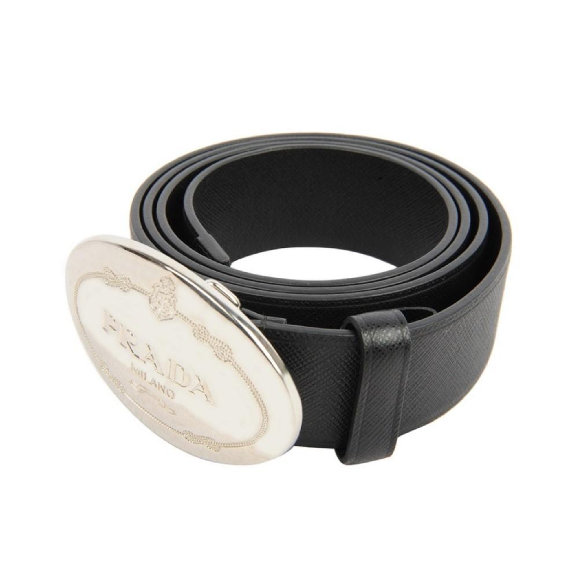 Prada Black Saffiano Leather Belt with Engraved Oval Buckle -  This Belt features black saffiano leather paired with a distinctive oval silver buckle engraved with the Prada logo. Its timeless design makes it a versatile accessory that complements any outfit with sophistication.Model: 2CM046Size: 110/44Black Saffiano LeatherSilver-toned hardwarePalladium plaque buckleIncludes Prada authenticity card and dust bagMade in Italy Shop Bags 