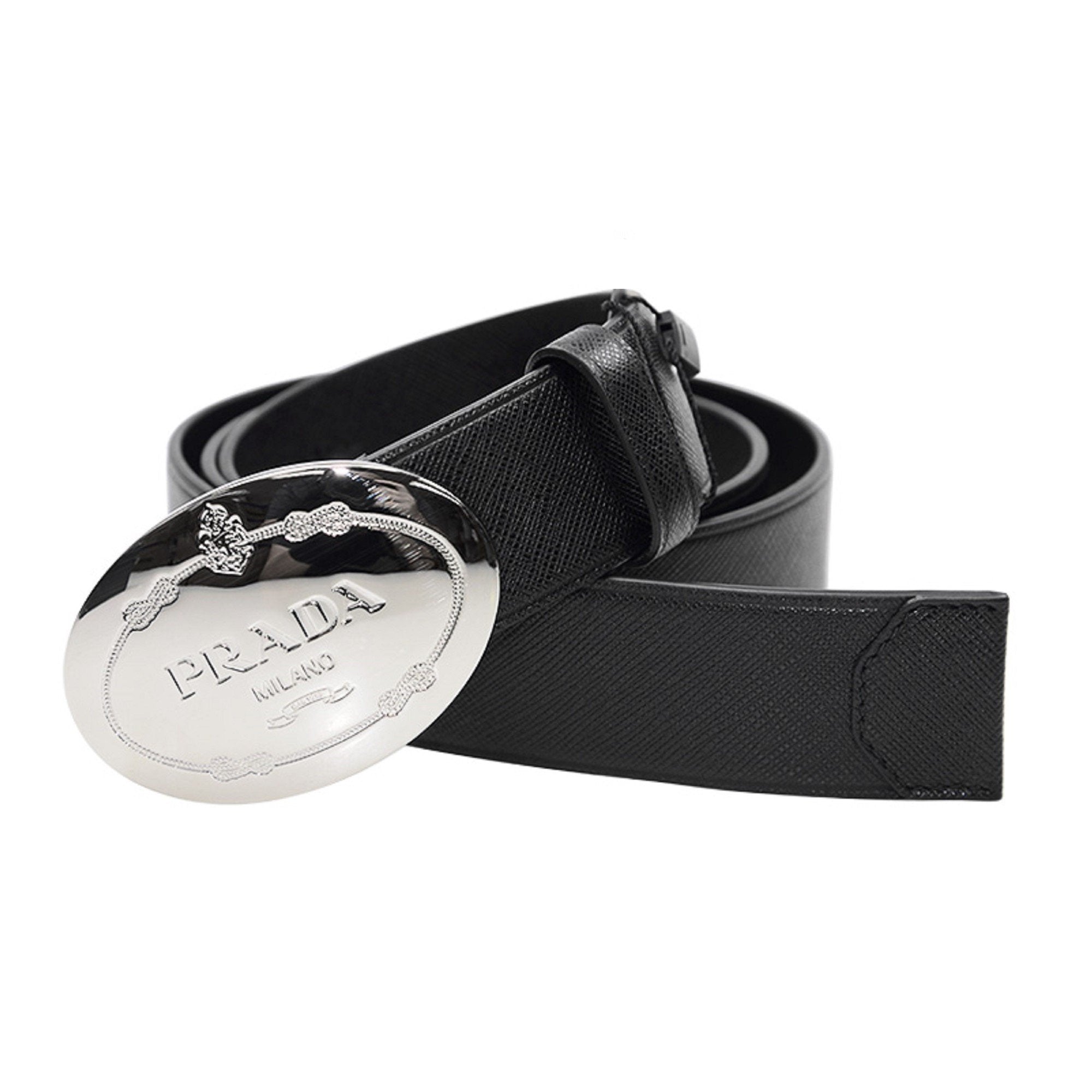 Prada Black Saffiano Leather Belt with Engraved Oval Buckle -  This Belt features black saffiano leather paired with a distinctive oval silver buckle engraved with the Prada logo. Its timeless design makes it a versatile accessory that complements any outfit with sophistication.Model: 2CM046Size: 110/44Black Saffiano LeatherSilver-toned hardwarePalladium plaque buckleIncludes Prada authenticity card and dust bagMade in Italy Shop Bags 
