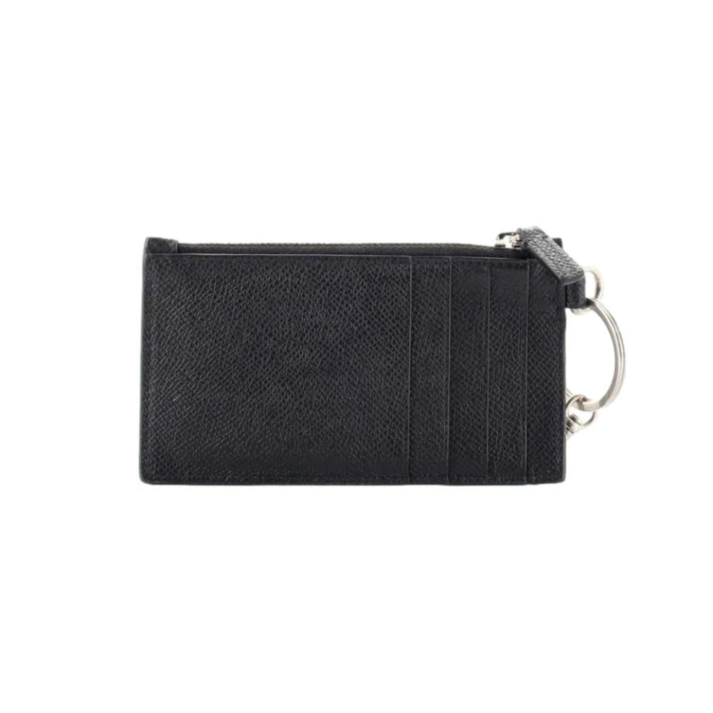 Balenciaga Wallet: Unisex Black Wallet & Card Holder with Lanyard -  Made from black textured leather, this Balenciaga Wallet and card case has a zipped pouch and four card slots, complete with a detachable lanyard for easy portability.Model: 594548Black Calfskin leatherWhite Balenciaga logoBlack leather interior liningFour card slotsTop zipper pocket Detachable leather lanyardStrap drop: 23" Measurements: 5.1 x 0.5 x 3" (LWH)Includes authenticity cardsMade in Italy Shop Bags 