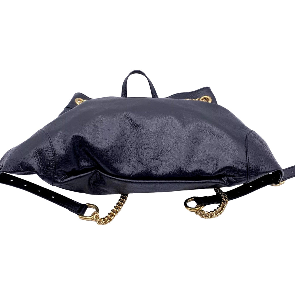 Gucci Zumi: Timeless Black Leather Backpack with Chic Gold Accents