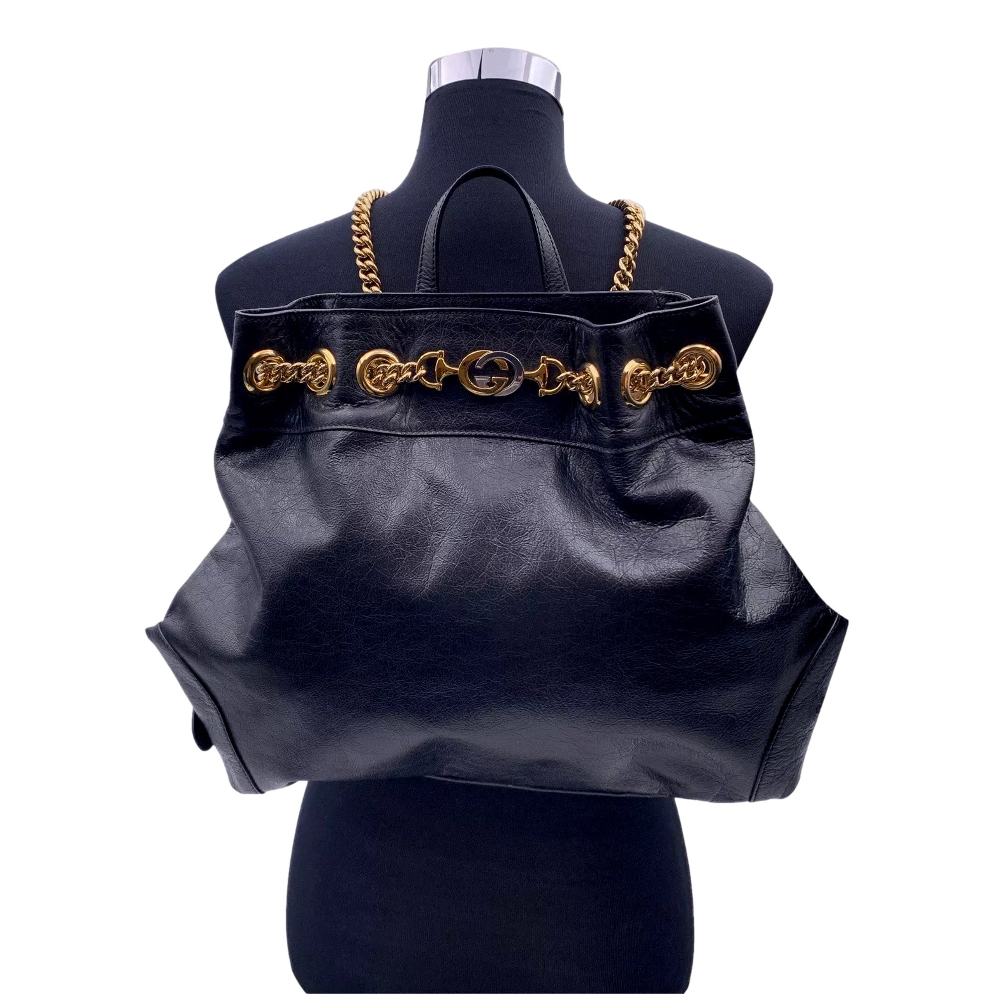 Gucci Zumi: Timeless Black Leather Backpack with Chic Gold Accents