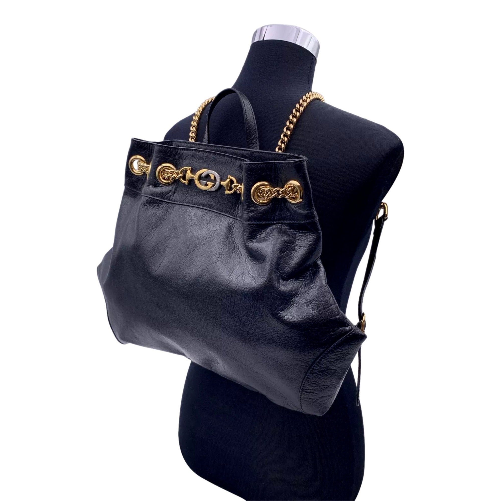 Gucci Zumi: Timeless Black Leather Backpack with Chic Gold Accents