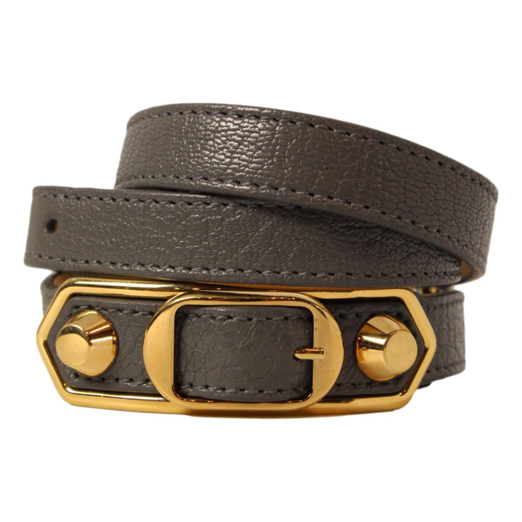 Balenciaga Arena Triple Wrap Studded Leather Bracelet - Dark Grey -  The Balenciaga Arena Triple Tour Wrap Bracelet, crafted from glossy leather, offers a refined yet casual accent to your collection. This elegant leather wrap bracelet introduces a discreet touch of sophistication to any outfit. Model: 390643Arena Triple Tour WrapDark grey leatherGold-tone hardwareBuckle closureMeasurements: Length 20.2“, Width 0.8"Includes authenticity card and boxMade in Italy Shop Bags 