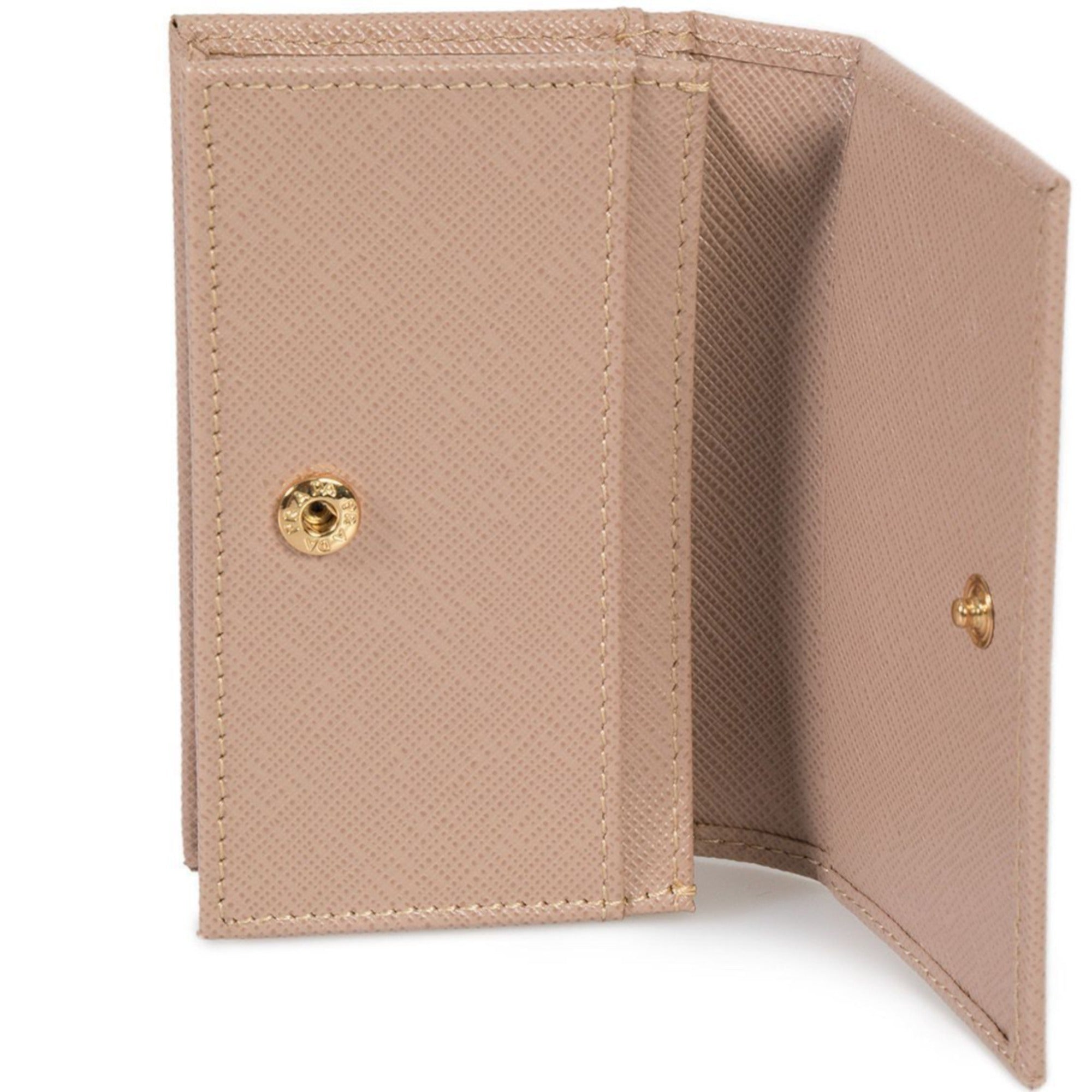 Prada Saffiano Leather Card Holder – Elegant Beige with Gold Logo -  This Prada saffiano beige Card Holder wallet is the perfect size for your personal necessities. The gold Prada Milano logo looks amazing with the beige saffiano leather. Includes authenticity cards and Prada box. Model: 1MC122Cammeo beige saffiano leather Gold-tone hardwareGold Prada Milano logo Snap closureThree card slotsMeasurements: 4.5" x 1" x 2.5" (LWH)Includes authenticity cards and Prada box Made in Italy Shop Bags 