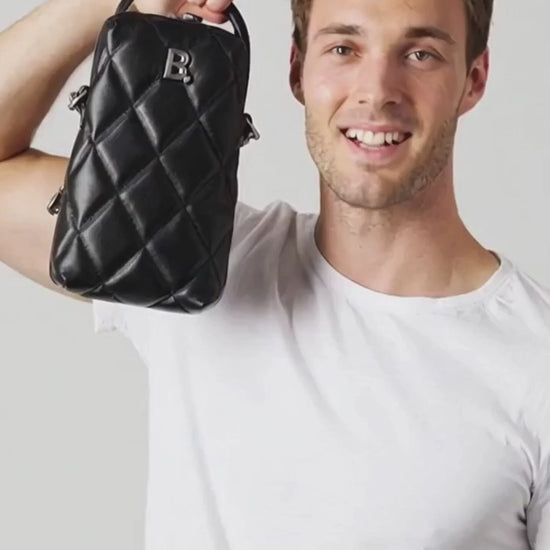 Man showing off a black bag