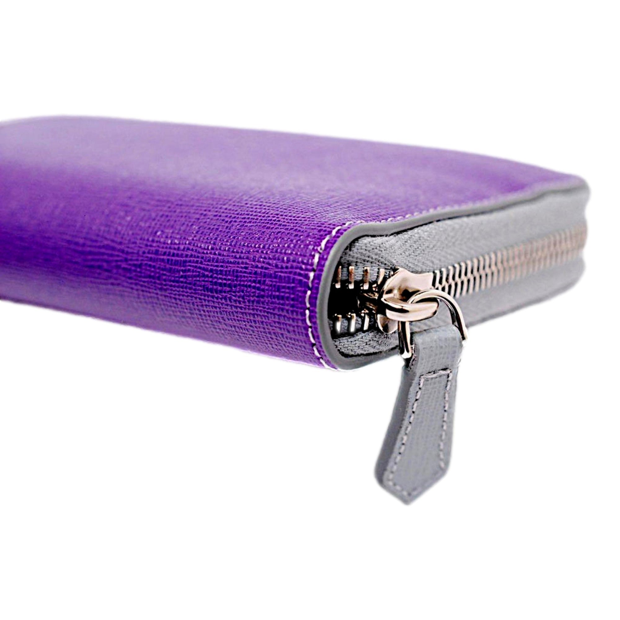 Fendi Monster Clutch: Vibrant Purple Blue Leather Pouch -  This charming Fendi Monster Pouch is an ideal companion for an enjoyable evening. Use it solo, as a wallet, or a cosmetic bag to introduce a vibrant splash of color and sophistication to your ensemble. Model: 8M0341Purple and Blue Leather Silver-tone hardwareZip top closureBlue canvas interior lining Measurements: 7.5" x 0.2"x 4.5" (LWH)Includes authenticity cards and Fendi dust bag Made in Italy Shop Bags 