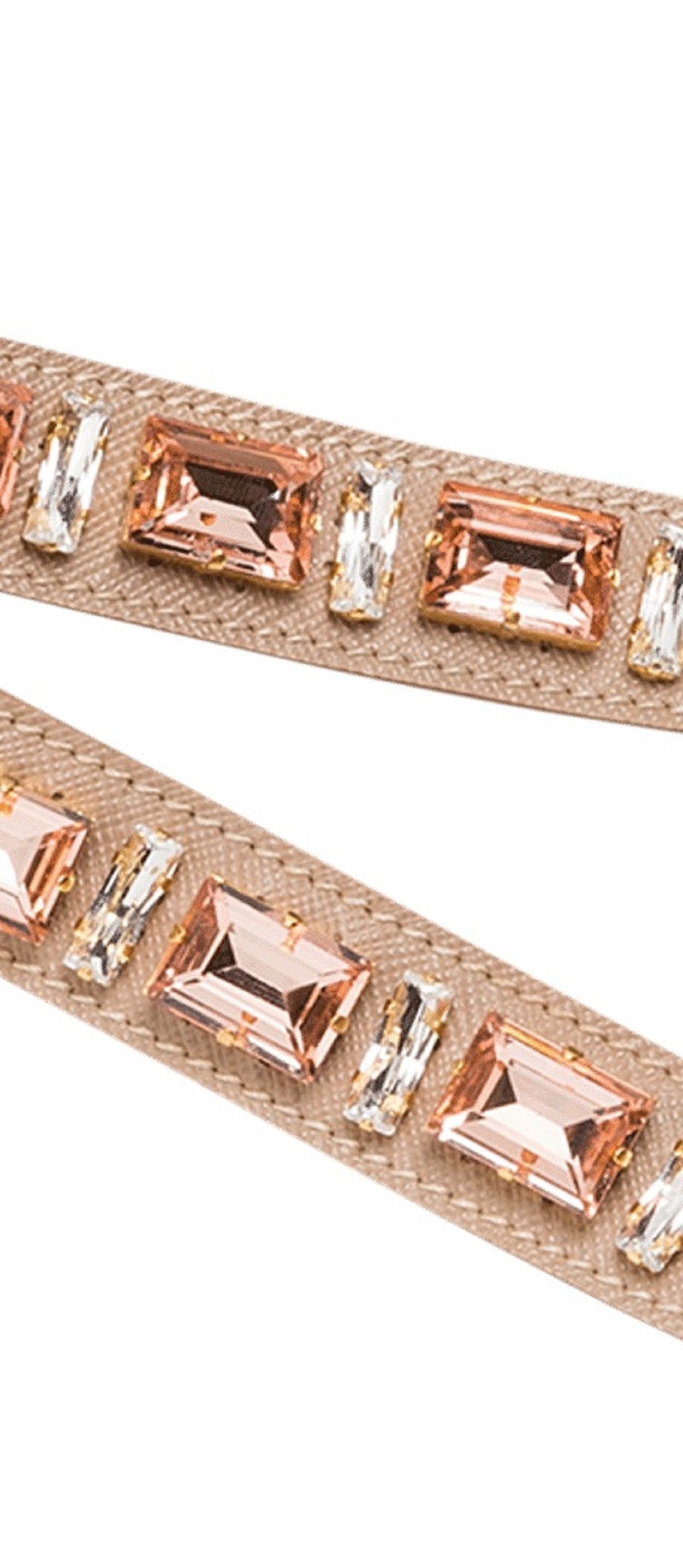 Prada Blush Pink Crystal Strap: Elegant Accessory for Any Handbag -  This elegant Prada Strap adds a subtle touch of sparkle to any handbag. Featuring lobster claw clasps on both ends, it offers effortless attachment for immediate use.Model: 1TY006Cammeo Beige (Blush Pink) Saffiano LeatherJeweledLength: 41inchesIncludes authenticity cards and boxMade in Italy Shop Bags 